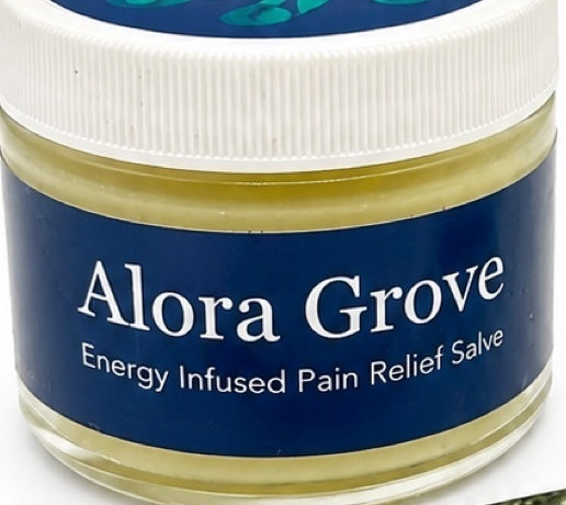 Close-up of an Alora Grove Energy Infused Pain Relief Salve jar with white lid on white
