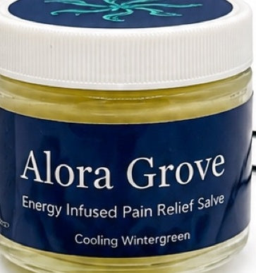 Close-up of an Alora Grove Energy Infused Pain Relief Salve jar labeled Cooling Wintergreen
